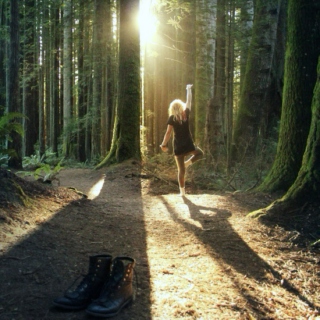 a girl walks into the woods