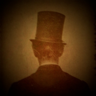 i: The Man in the Stovepipe Hat