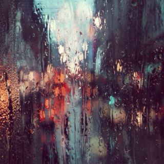 All I can see are blurs of red and yellow through the raindrops..