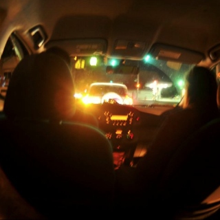 Driving Through a City at Night.