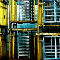 Several Mechanical Objects in a Warehouse Grooving With a Pict