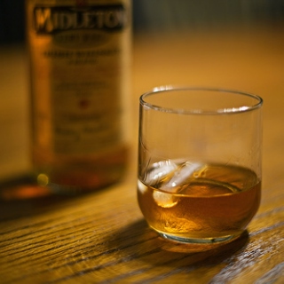 a scotch in hand