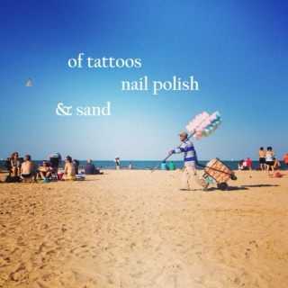 of tattoos, nail polish & sand
