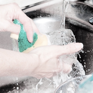 vigorously washing dishes