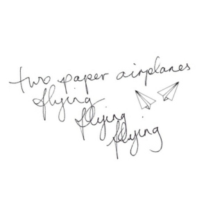 Two Paper Airplanes Flying