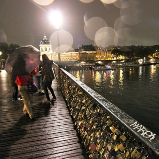 Kissing Someone on a Bridge at Nighttime