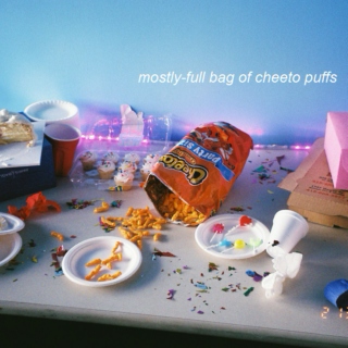 mostly-full bag of cheeto puffs