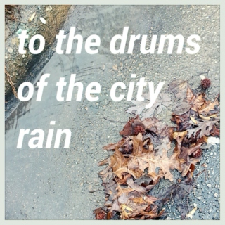 to the drums of the city rain