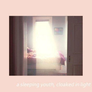 a sleeping youth, cloaked in light