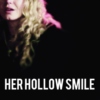her hollow smile.
