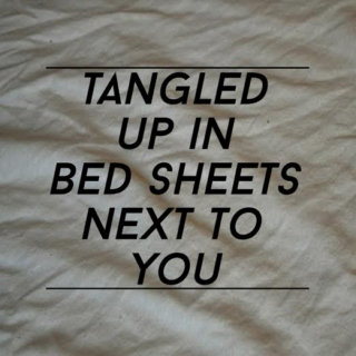 tangled up in bed sheets next to you