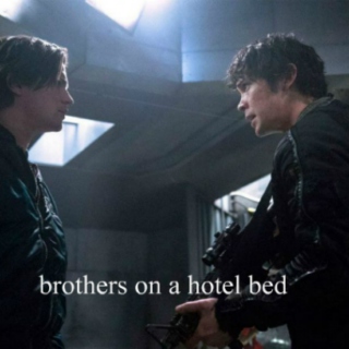 brothers on a hotel bed