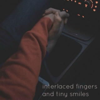 interlaced fingers and tiny smiles